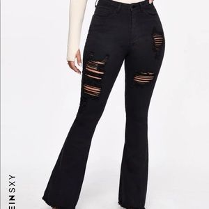 SHEIN SXY Raw Hem Ripped Flare Jeans